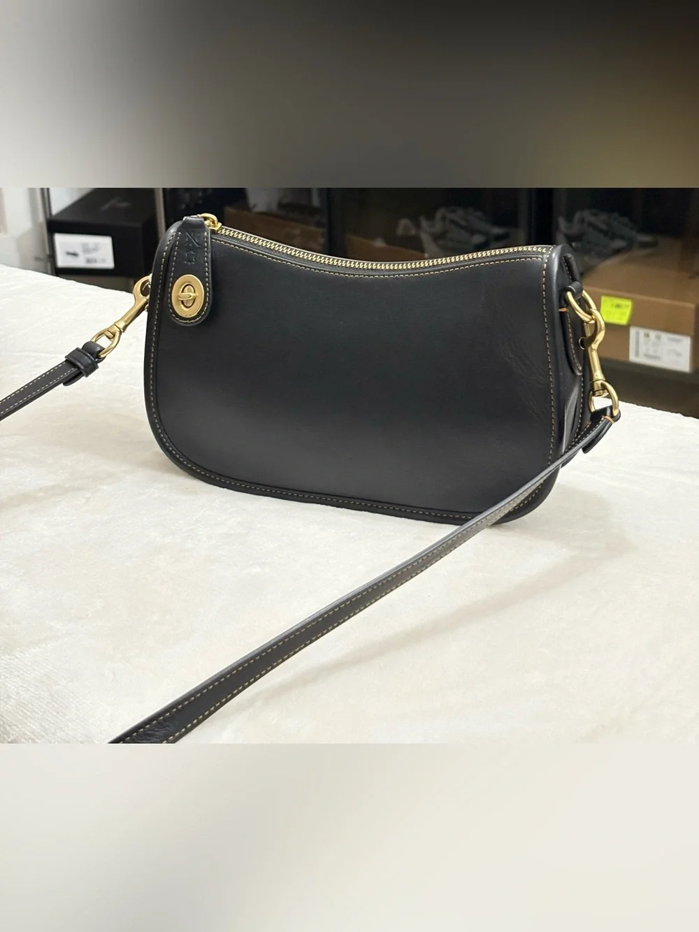 Coach Black Swinger Glove-Tanned Leather Crossbody Bag.